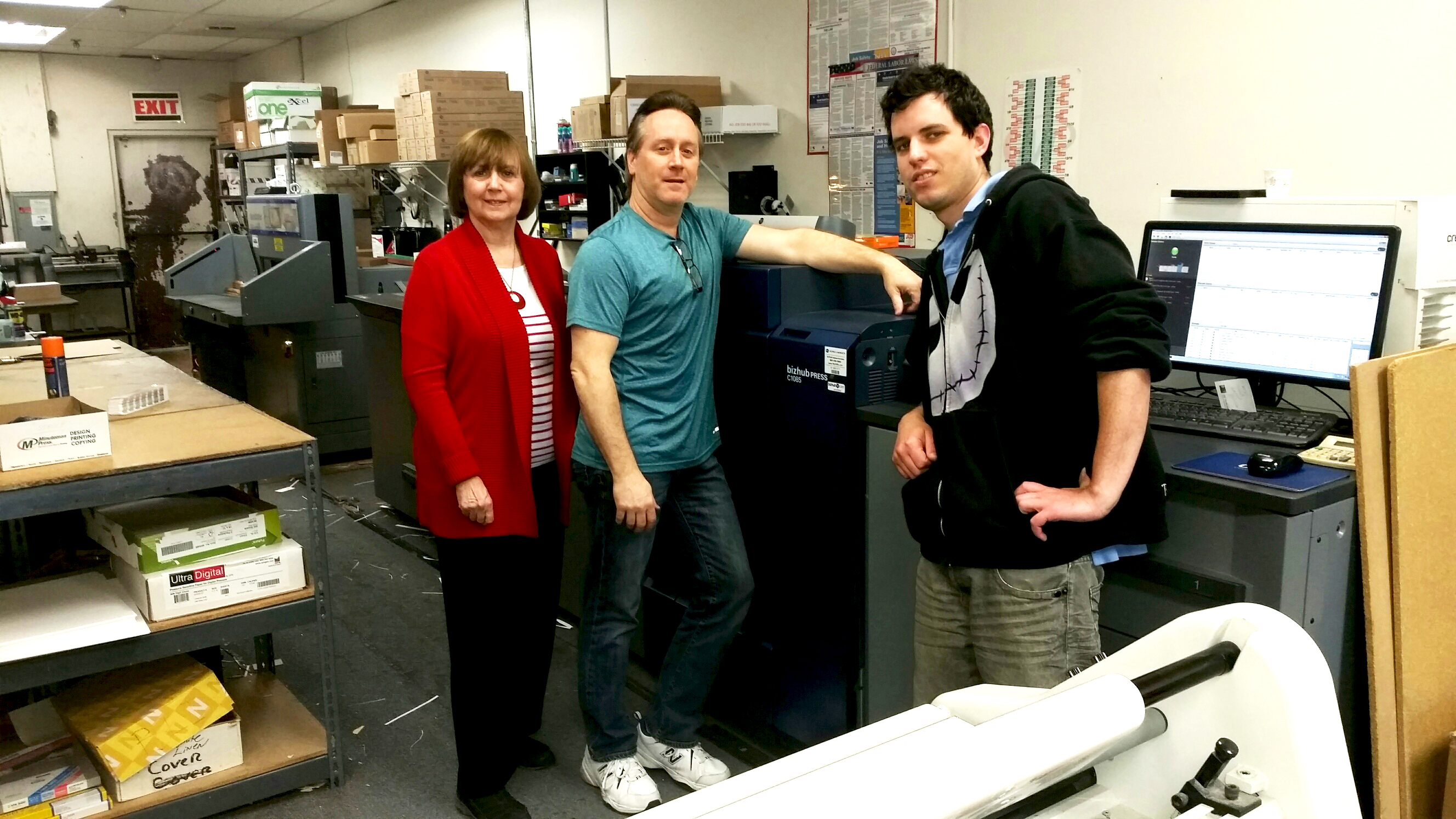 The Minuteman Press franchise in Selden, NY appreciates the speed and efficency of their Konica Minolta C1085 digital press. Pictured from left to right are: Rita Passeggio – Owner, Scott Bomine – Shop Manager, and Miles Mongeau – Graphic Designer
